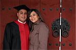 University graduate with his wife - happy and successful