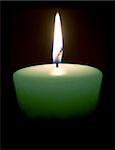 Isolated candle on a black background.