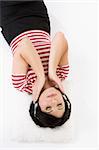 A woman at leisure enjoys some music or meditation