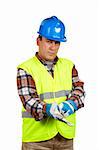 Construction worker with gloves and green vest