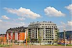 A built modern apartments blocks over a sunny sky