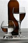 Wine  glasses with water and bottle