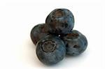 Four blueberries isolated against a white back ground