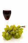 Red wine and grapes on white background