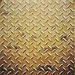 a very large sheet of roughened gold tread or diamond plate