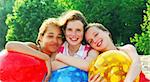 Portrait of three girls on a sandy beach