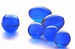An abstract picture of vitamins pills in blue color
