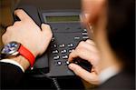 young businessman making a phonecall in his office