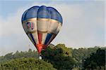 Hot air balloon taking off in mass ascent