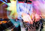 a funky female dj, mixing on turntables with abstract light pattern overlayed
