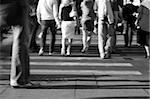 Pedestrians crossing a street of big city. Black and white, special motion-blur photo f/x