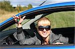 woman in a blue car