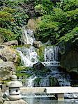 Traditional Japanese Kyoto gardens with big waterfalls