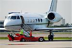 Small charter jet airplane on the ground