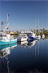 Boats moored at a wharf.