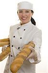 Chef or foodservice worker holding seeded rolls