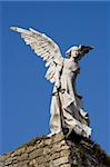 Statue of an angel made of stone from a cemetary in Cantabria, Spain.
