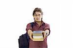 Portrait of a male student holding books and wearing glasses - isolated