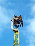 Enjoying a funfair ride in Llandudno, North Wales.