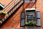 Fragment of a red brick house in Boston historical North End