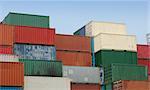 Shipping containers waiting to be loaded on a cargo ship.