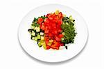 Salad made of fresh tomatoes, cucumbers, red, yellow and green peppers, parsley.