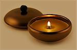 Aroma candle in bronze lamp