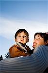 mother and son over blue sky