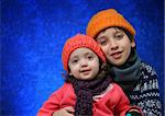 Brother and sister hugging in winter outfit. Look at my gallery for more winter images
