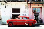 Classic red American car in Havana street