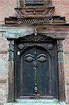 wooden door in Bhaktapur, Nepal with eye of Buddha symbol-- from Durbar Square area