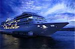 Ocean liner at St. Petersburg's port in the summer evening. Clouded skies and culm water.