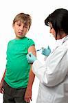 A child receives a vaccination with some trepidation.