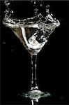 martini splash on black background close up