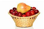 Wicker basket with cherry plums and yellow-red pear isolated on the white background