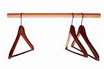 Empty hangers for clothes on rail isolated on white with clipping path included
