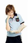 Handsome boy holding book at white background