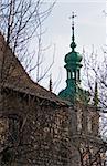 Lviv Watchtower stone wall ("Porohova Vegha") and church top (Uspenjska (Dormition of Virgin Mary)) in the distance (Lviv City, Ukraine)