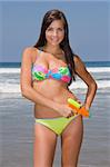 Fitness model Brittany offers her humorous recreation of the classic Bond Girl emerging from the surf.