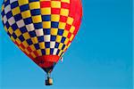 A colorful hot air balloon underway.