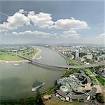 Wide angle picture of river Rhine und Düsseldorf, seen from the television tower Rheinturm. On the left side district Niederkassel, on the right side the city center, in front of bridge Rheinkniebrücke you can see the Landtag, the government of Nordrhein-Westfalen in the west of Germany.