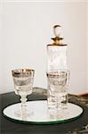 Antique glass bottle and glasses - home interiors.