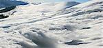 Wind form ice lumps on mountain landscape background (Ukraine, Carpathian Mt's, Stara and Petros mount behind). Five shots stitch image.