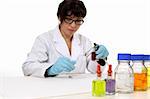 Scientist sitting at desk during work using a spotting plate for testing.  copyspace.