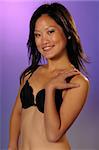 Pretty young Vietnamese girl in a black bra