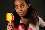 Portrait of cheerful african american child with lollipop