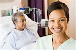 Nurse Standing In Patients Room