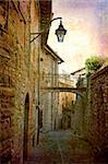 Artistic work of my own in retro style - Postcard from Italy. - Architecture urban alley, Gubbio, Umbria, Italy