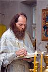 The Russian orthodox priest in a temple