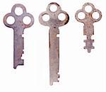 Three rusty weathered skeleton keys isolated on a clean white background.